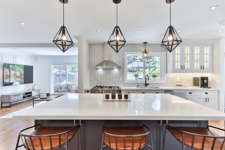 A well-lit kitchen in a Martha’s Vineyard home with modern lighting solutions. 