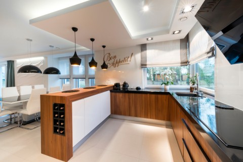 The image is of a luxury kitchen in a smart home.